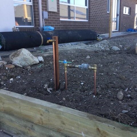 Tap and water metre in front yard